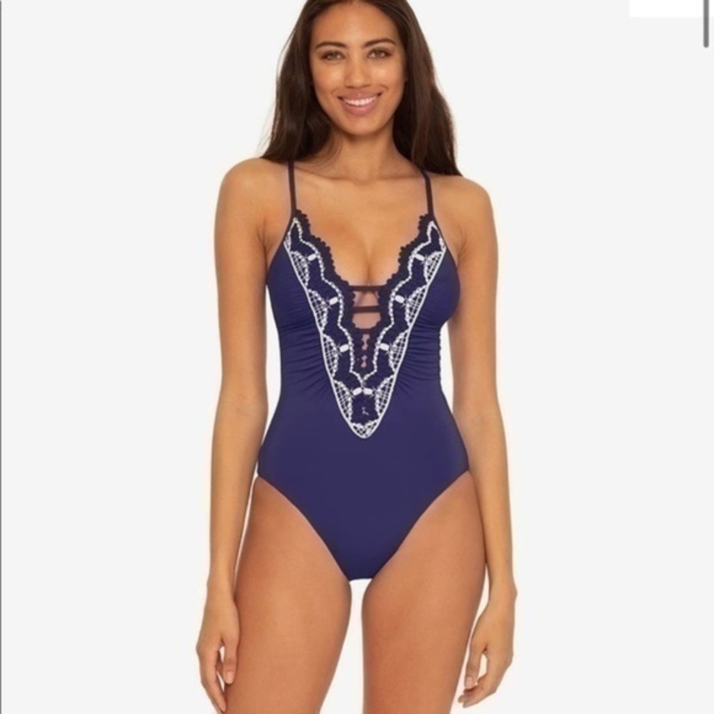 Becca Delilah Clare Plunge One-Piece in a navy blue color.